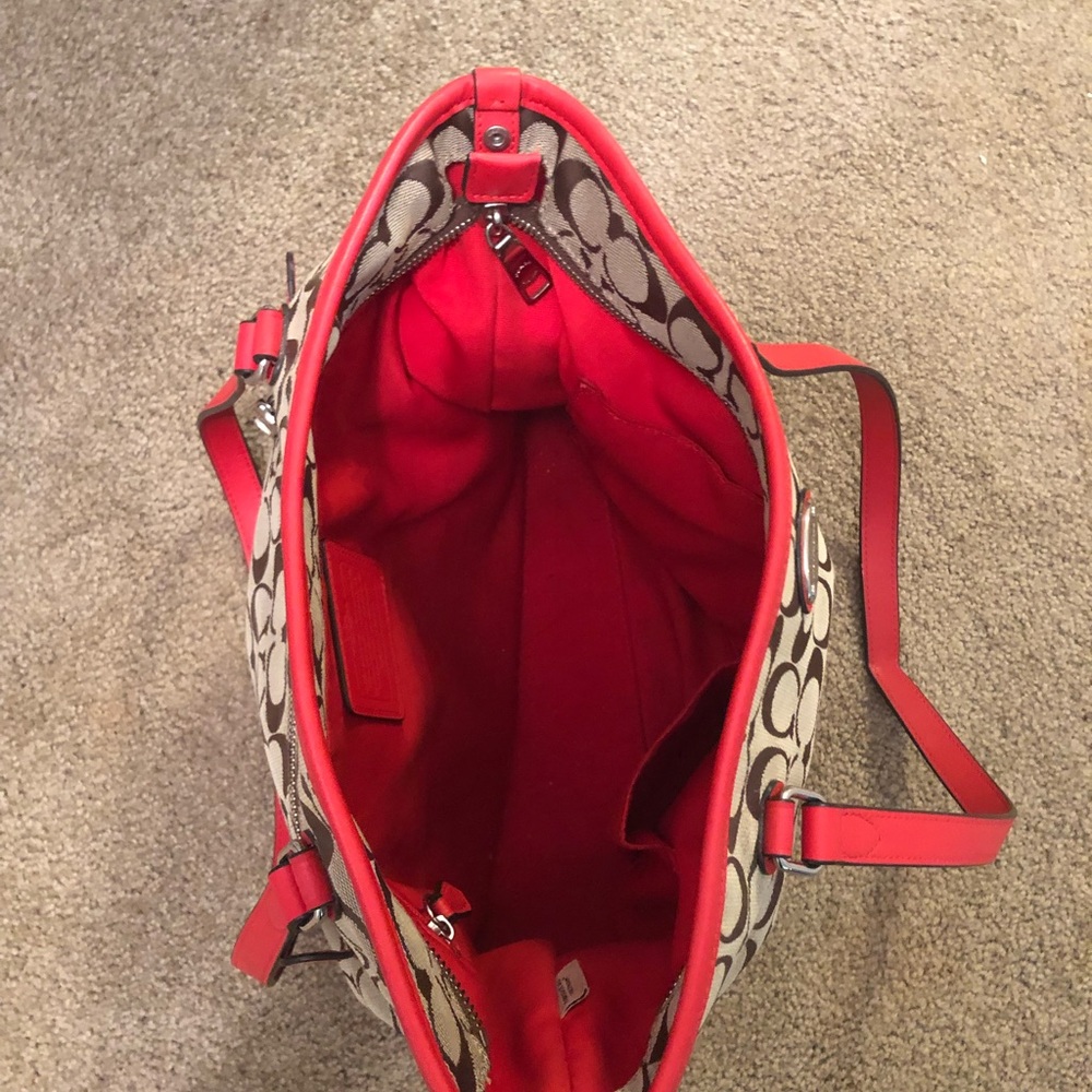 Red strapped Coach tote bag